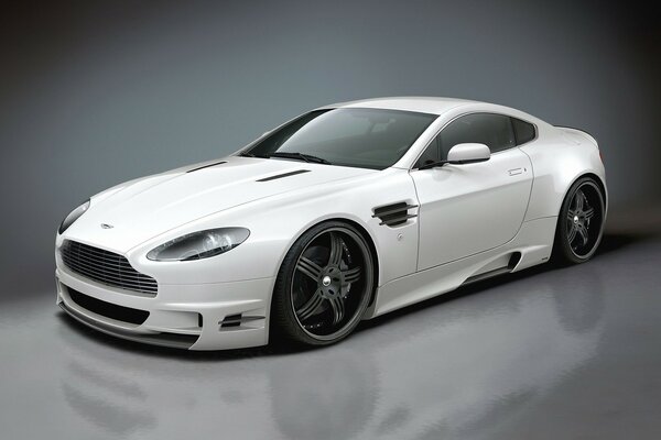 White aston martin on black wheels