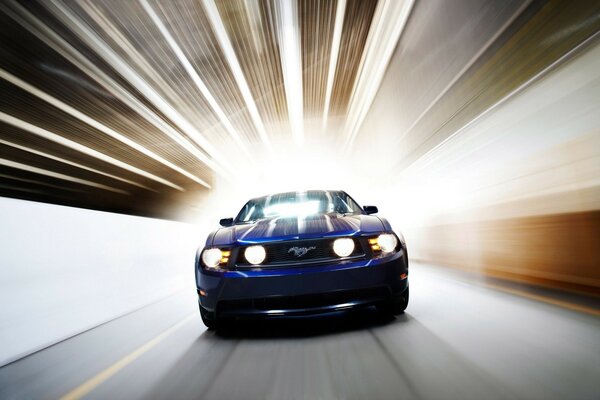 Ford Mustang drives fast through the tunnel