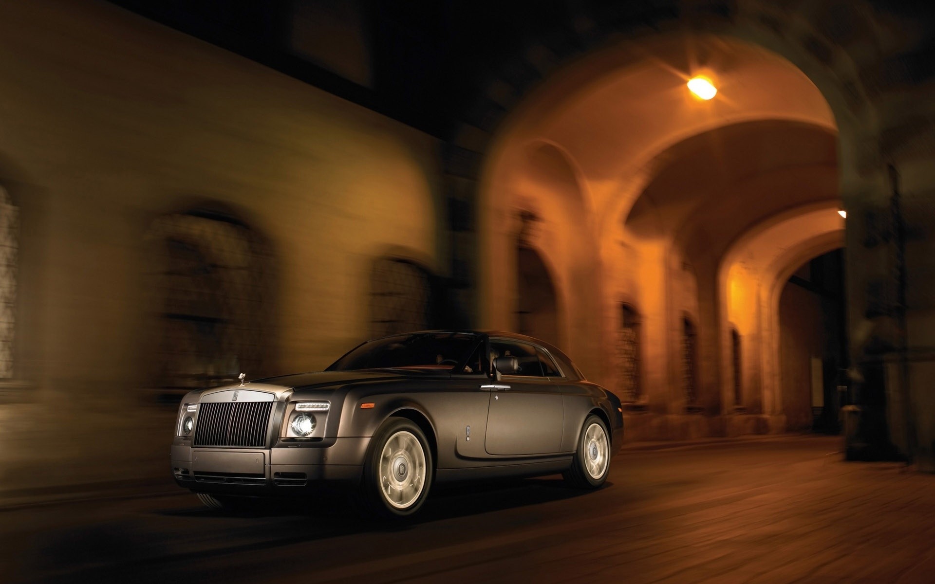 rolls royce car pavement street blur city vehicle road travel light transportation system urban