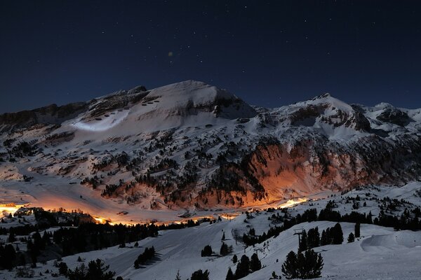 A glowing road in the snowy mountains