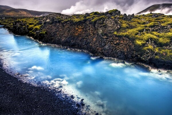 Iceland landscape blue calcite stream near geothermal