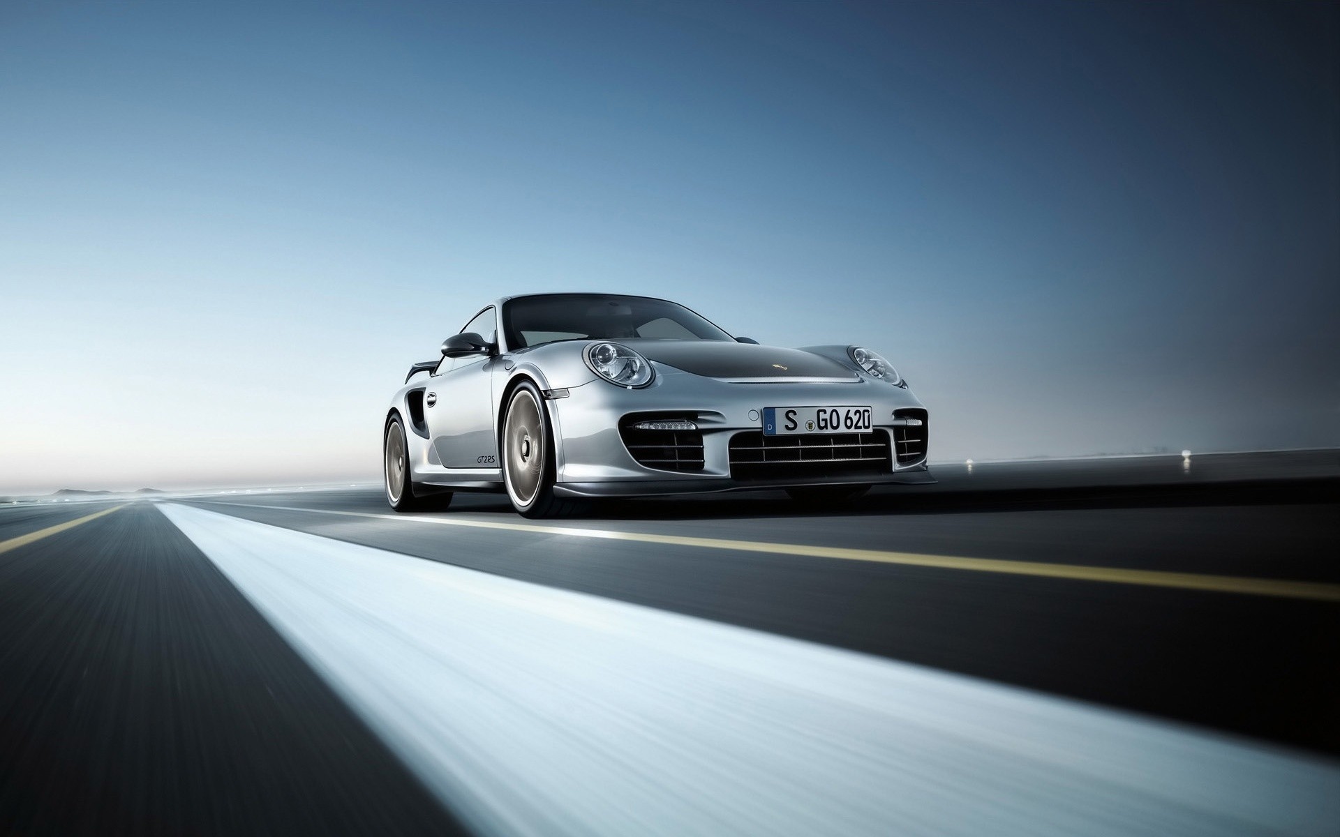 porsche car vehicle asphalt hurry transportation system blur fast road pavement drive action automotive blacktop wheel race street noon