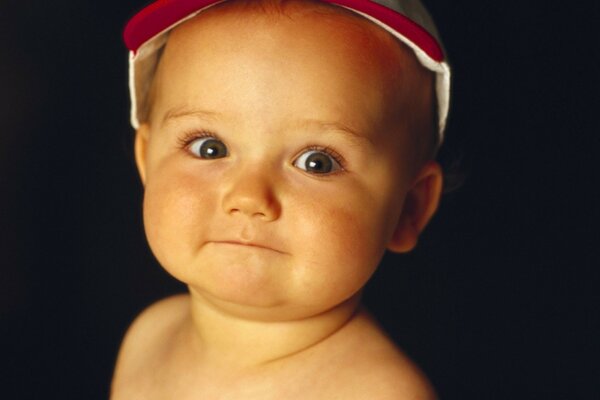 A little man with a cap on his head