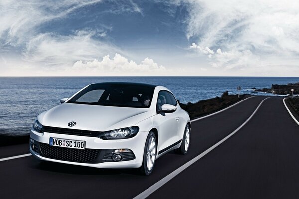 White volkswagen on the seashore