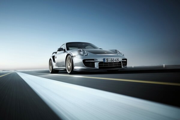 Luxury Porsche rushes along the highway