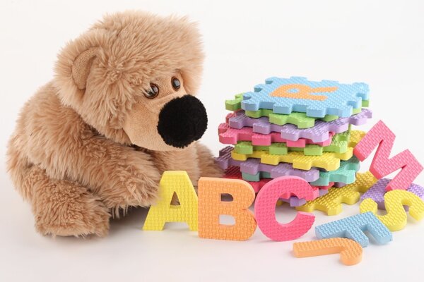 A stuffed toy and a colorful alphabet