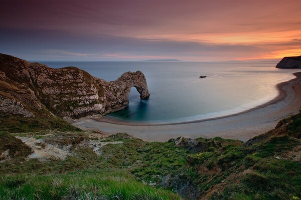 Quiet seascape against the sunset sky