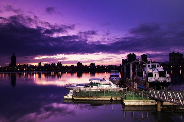 Night berth with a boat on the river