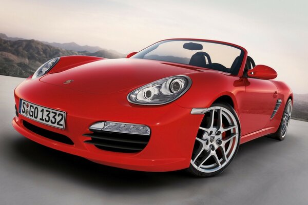 Luxury red Porsche on the background of nature