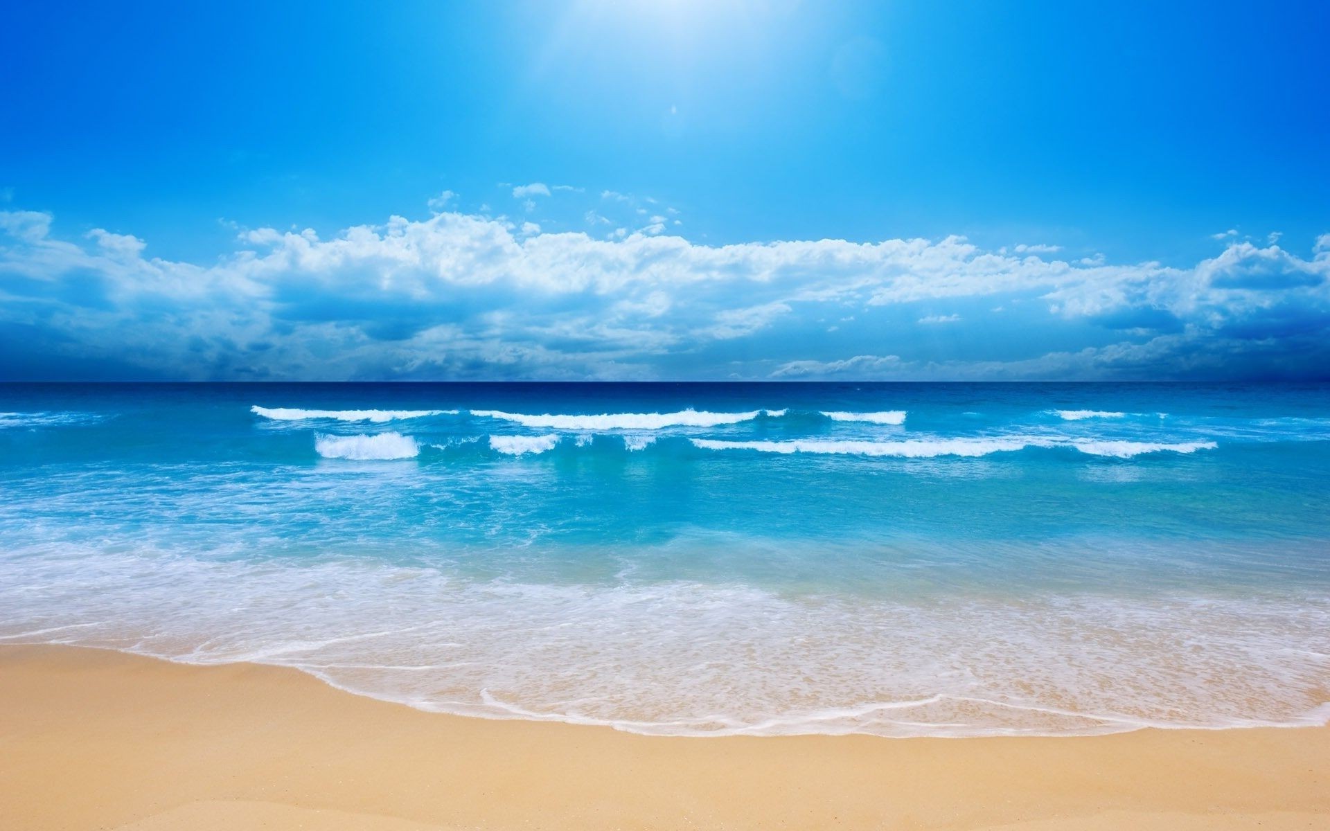 sea and ocean sand water tropical beach summer sun surf travel fair weather sea seashore seascape sky ocean nature relaxation turquoise idyllic vacation