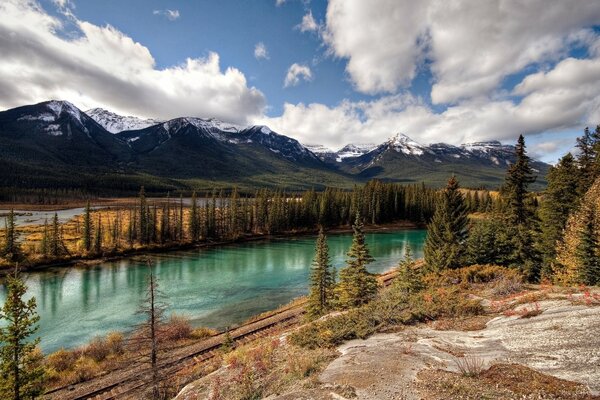 Lake on the background of mountains and forests