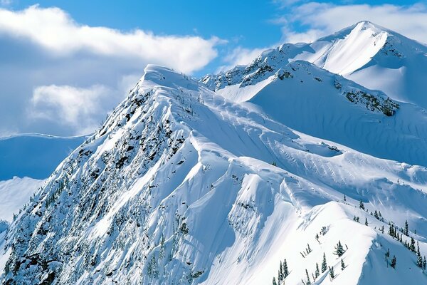 Mountains in the snow blue sky