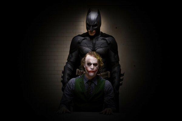 Batman. The Joker. Dark background