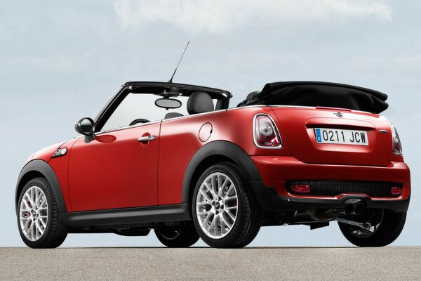 Red mini car with alloy wheels