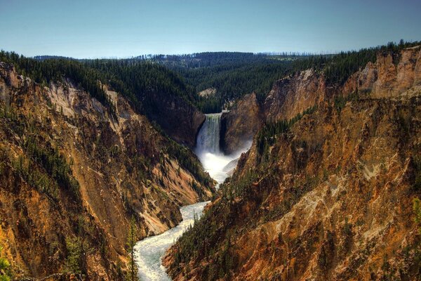 Mountain waterfall on a fresh sunny day