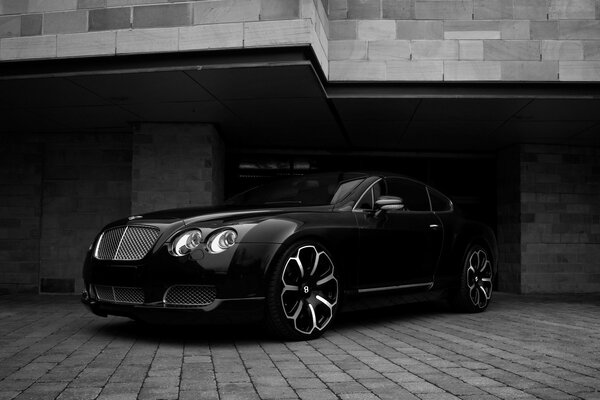 Black bentley car with chic wheels