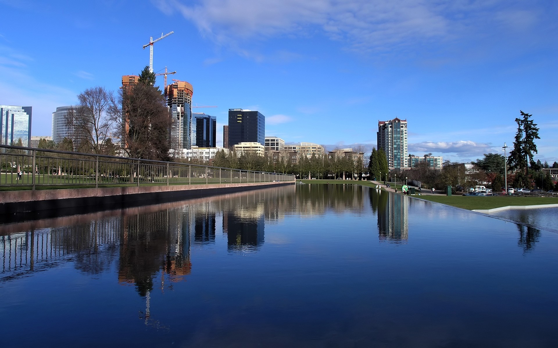 other city reflection architecture water city travel river sky outdoors building lake buildings streets park