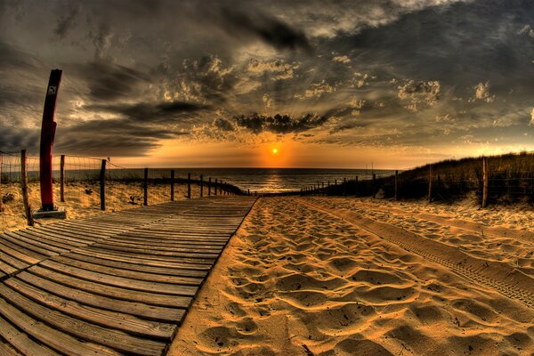 Sandy beach sunset in the sea