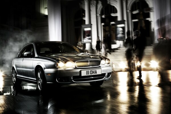 A car against the background of the blurriness of the night city