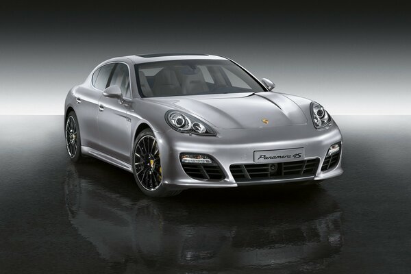 Grey Porsche on a glossy surface