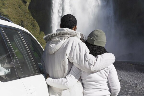 A couple in love at a waterfall