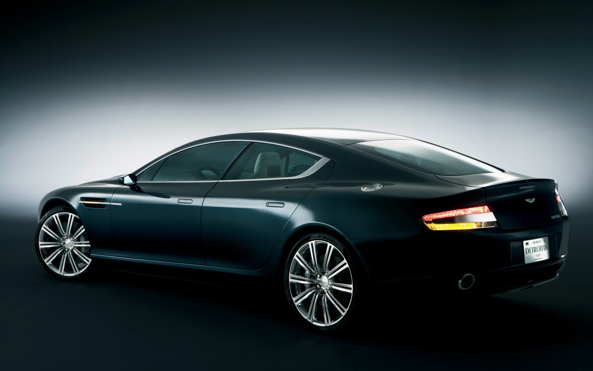 concept cars car vehicle wheel blacktop automotive noon pavement coupe asphalt action aston martin concept