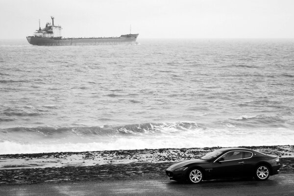 Gray Maserati on the background of the sea