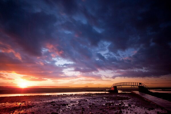 Twilight covers the bridge over the water