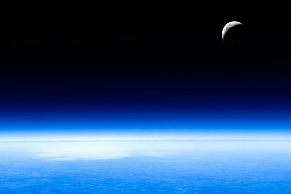 Glowing crescent moon view from space