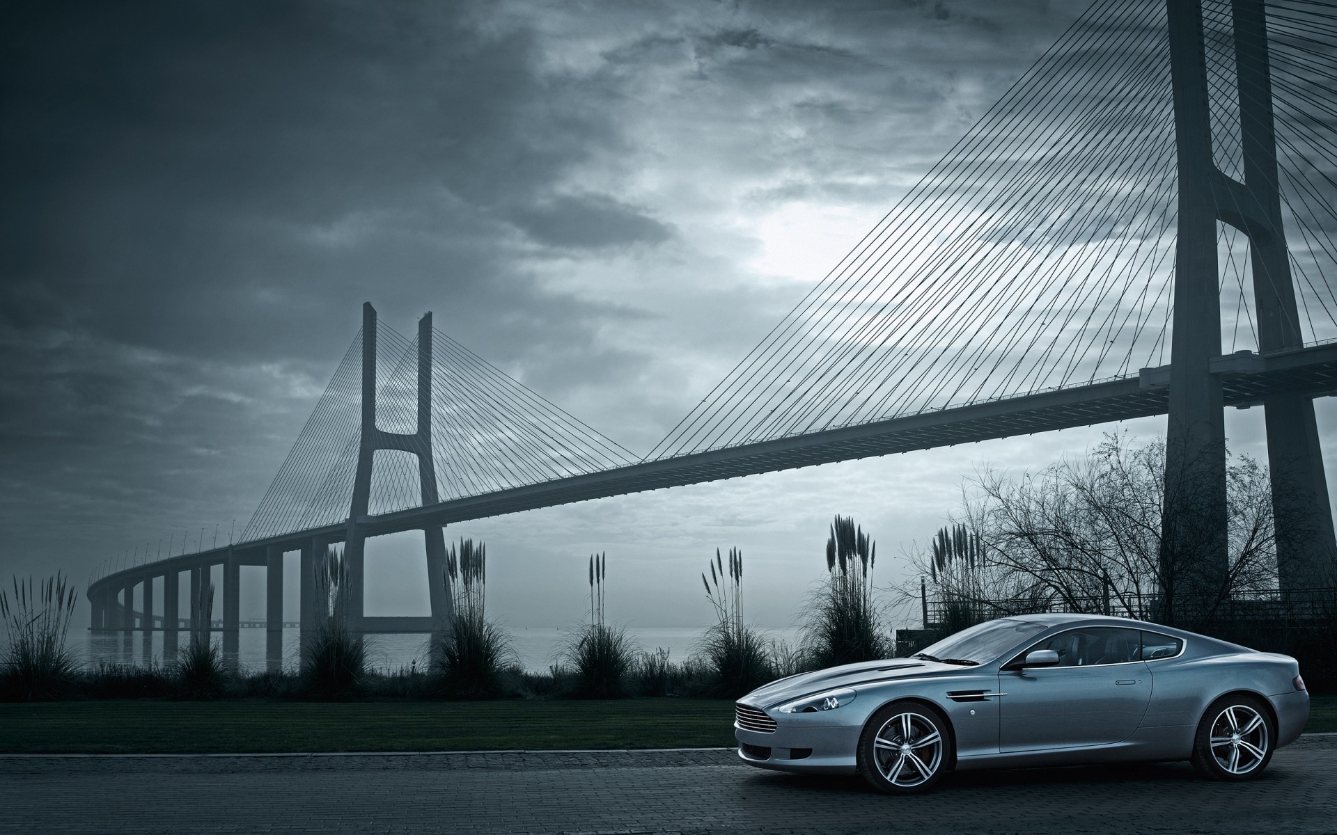 aston martin bridge car transportation system road city architecture urban vehicle travel street traffic building sky modern monochrome highway aston martin db9