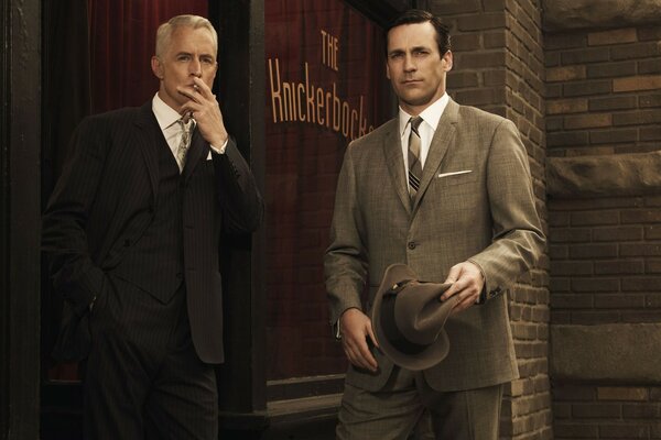 A frame from the movie. Men in suits