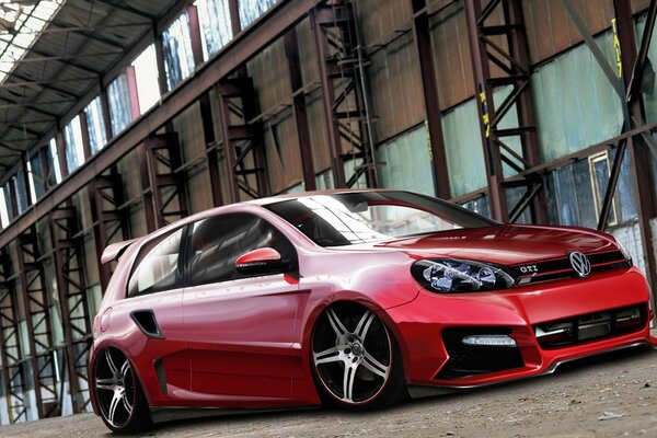 Voiture de sport rouge sur fond de maison