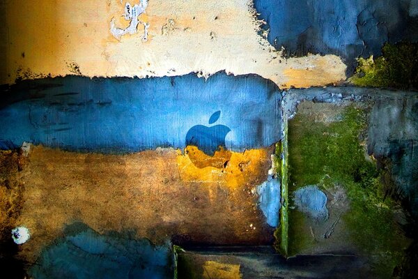 Символ Еппл на тлі брудної різнокольорової стіни