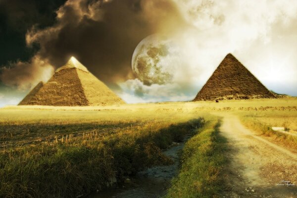 Egyptian pyramids on a green field