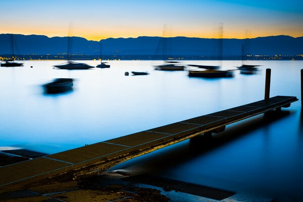 River. Catwalks. Boats on the water. Blurred background