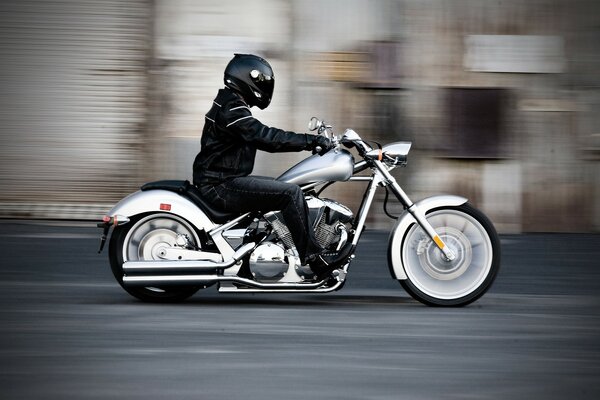 A man in a helmet on a bike in motion