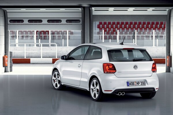 The volkswagen car is in the garage