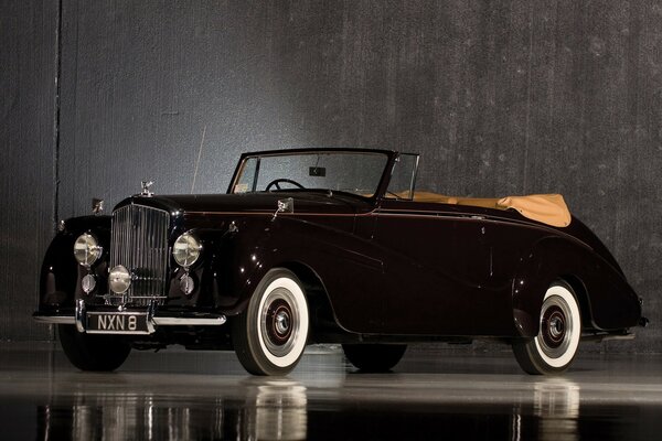 Black vintage car with an open top