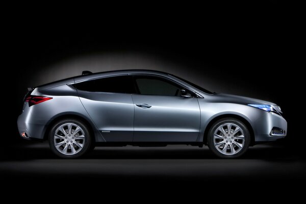 Stylish grey car on a black background