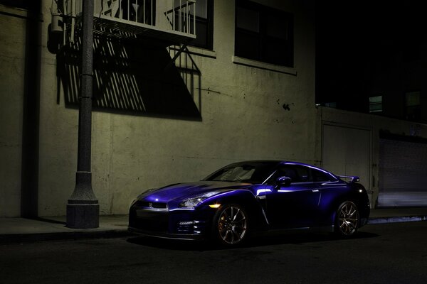 Blue Sports nissan at night