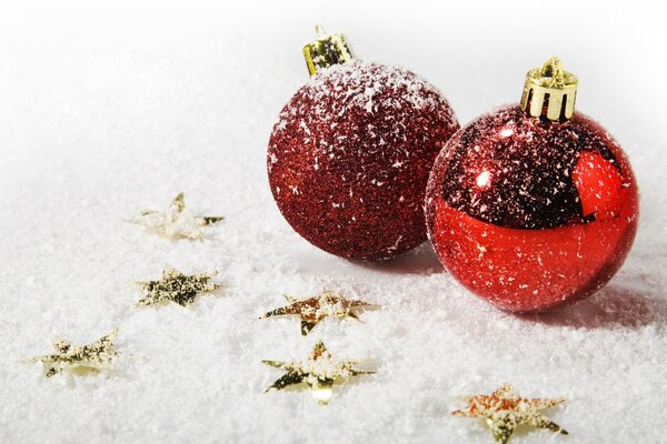 Two red balls in the snow