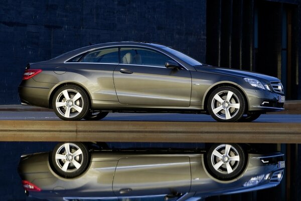 Reflection of a cool Mercedes in the water