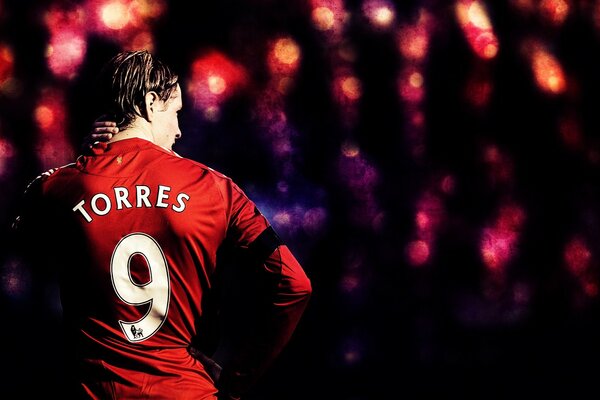 Liverpool football player on a black background with lights