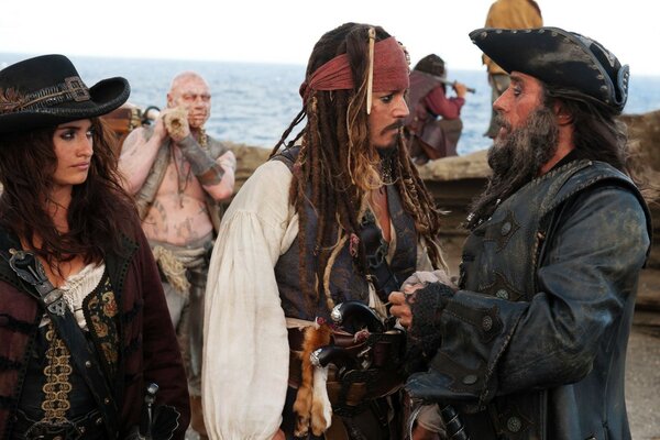 Jack Sparrow is standing with the pirates discussing business