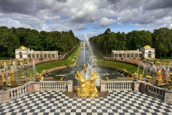 Beautiful architecture. The palace garden. Fountain in the garden. Golden statues. Landscape