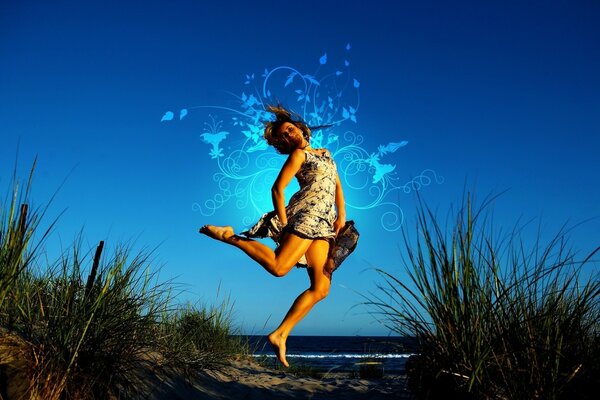 A girl dancing at dusk on the seashore