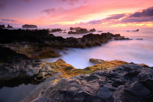 Sunrise on the background of misty mountains