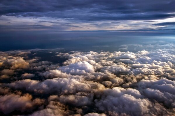 Dark blue sky grey and white clouds