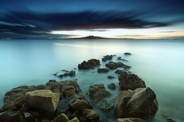 Sunset lights up the rocks in the ocean