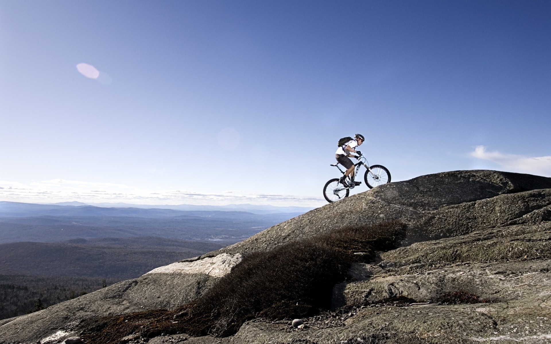 cycling landscape mountain sky travel adventure road hill outdoors rock nature sport bike recreation stones boy